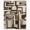Adobe Glyph brown and cream tribal geometric wool rug with carved maze-like shapes on a chocolate-brown ground