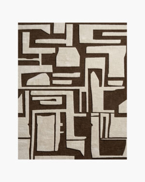 Adobe Glyph brown and cream tribal geometric wool rug with carved maze-like shapes on a chocolate-brown ground