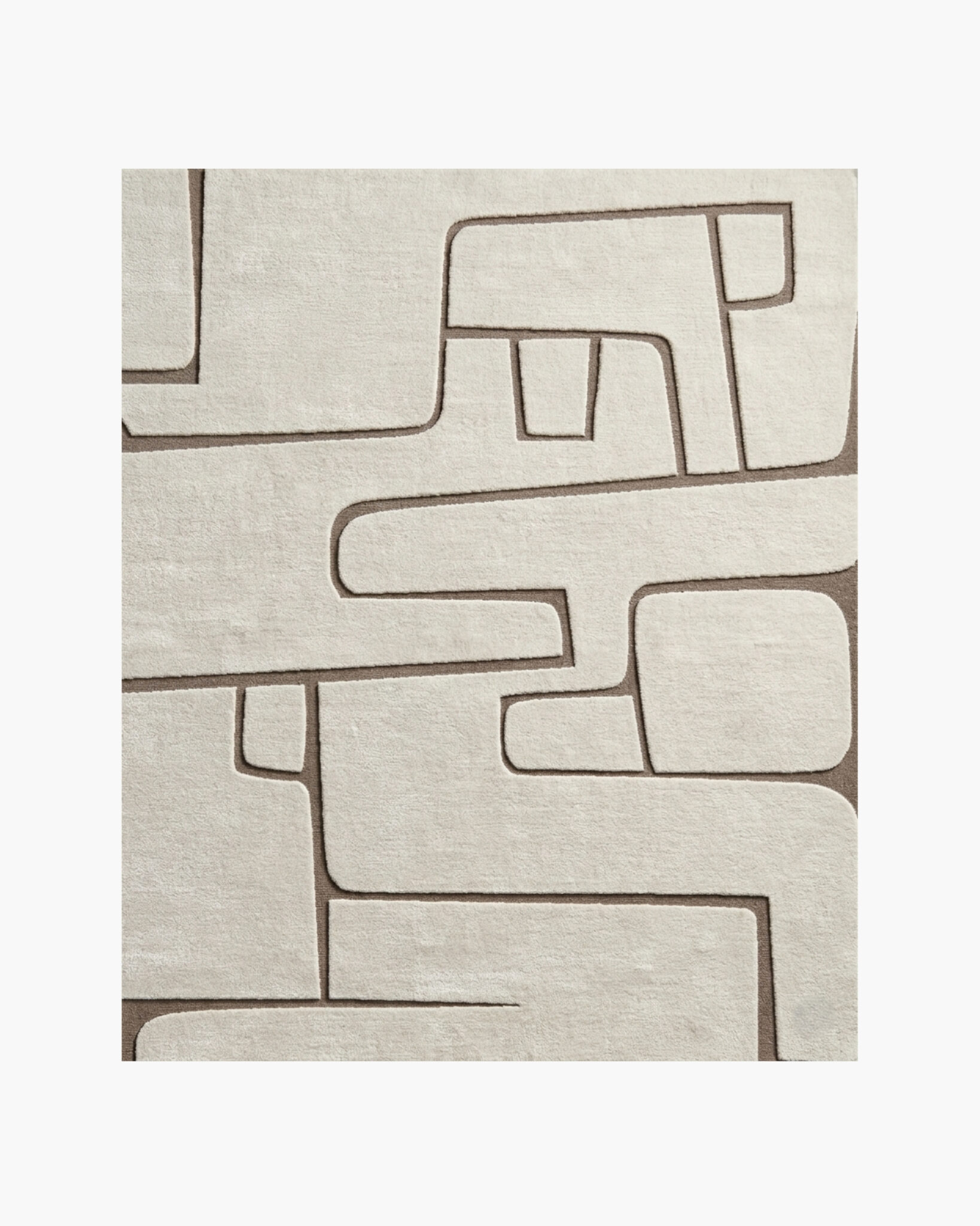 Alabaster Maze ivory carved abstract wool rug with rounded maze-like shapes in tonal high-low relief