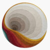 Nautilus Dawn round spiral wool rug with tonal greige rings tunneling to a core and a warm sunset sweep