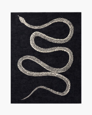 Serpentine Noir black and white snake wool rug with an ivory serpent winding down a charcoal-black ground