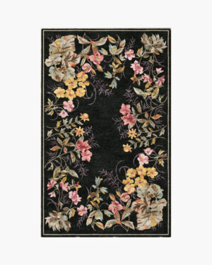 Midnight Garland black floral border rug with a wreath of roses and blossoms framing a black center
