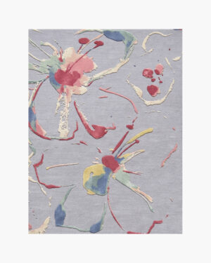 Splatter Bloom: a hand-tufted paint splatter wool rug — bursts of pink, sage and yellow on a dove-grey ground in carved relief. Custom sizes, free worldwide shipping.
