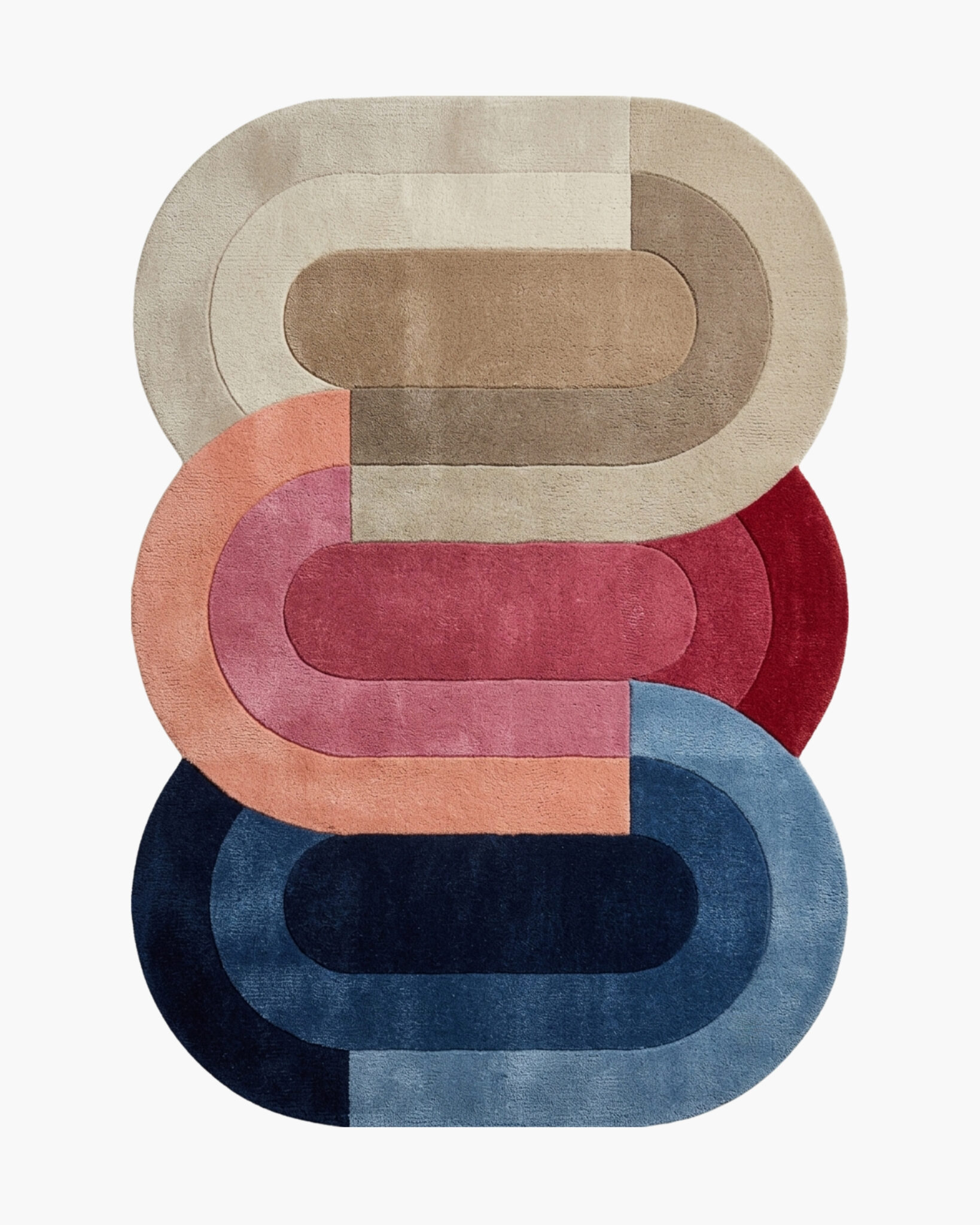 Stacked Ovals concentric oval wool rug with three overlapping tonal ovals in neutral, coral and navy