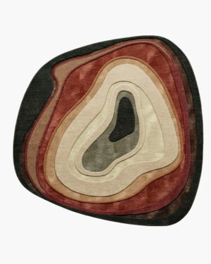 Canyon Agate organic wool rug with carved geode rings in terracotta, copper, cream and sage and a green center