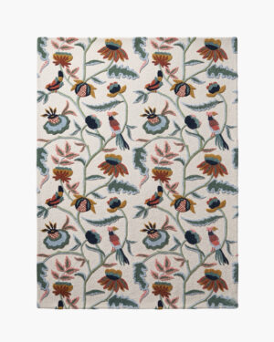 Aviary Bloom bird and floral wool rug with William Morris-style blooms and perched songbirds on a cream ground