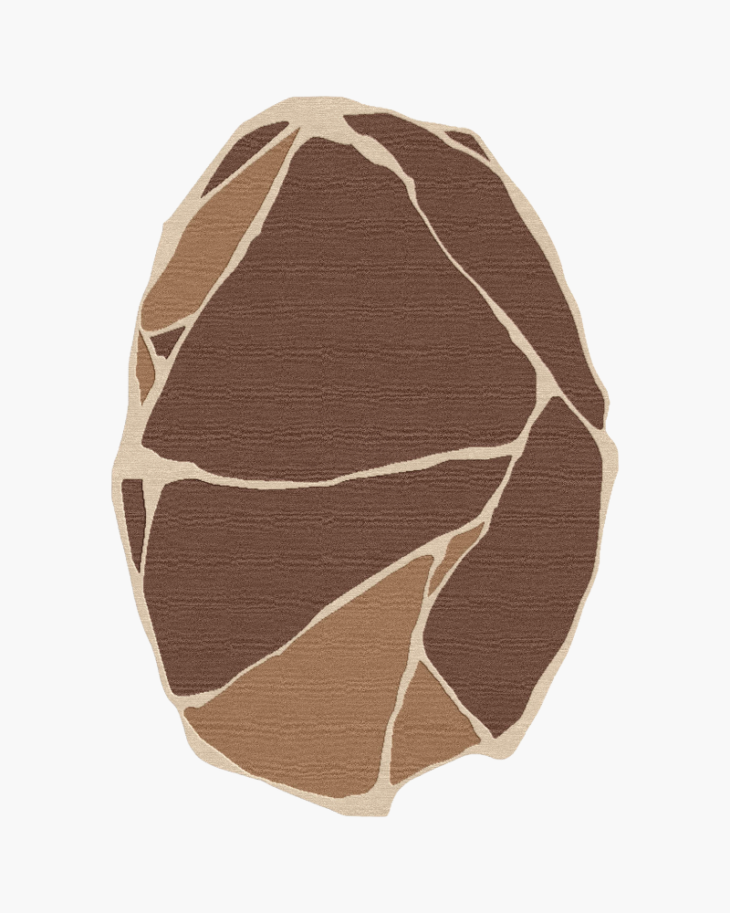 1 Zevra organic abstract rug in chocolate brown, caramel and ivory with an irregular stone-inspired pattern.