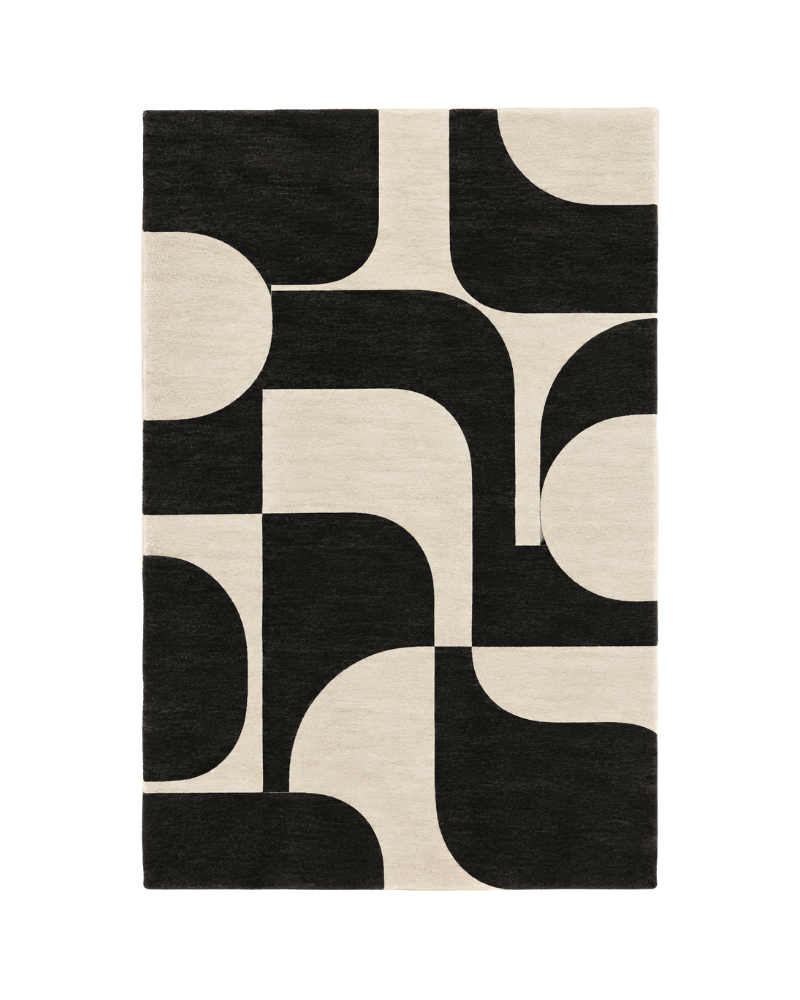 1 Noirvelle black and ivory geometric hand-tufted wool rug featuring bold abstract blocks, rounded curves, and contrasting monochrome shapes, crafted from 100% New Zealand wool by Hali Rug Company.
